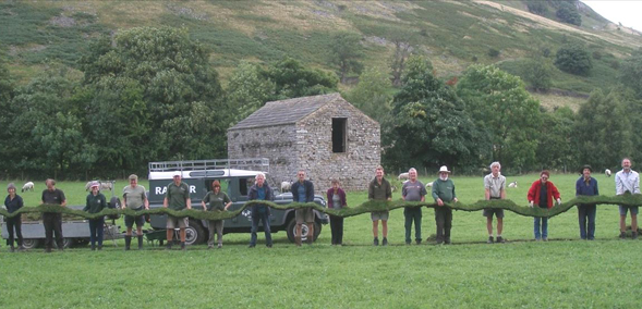 How long! Volunteers clear footpath of overgrown turf