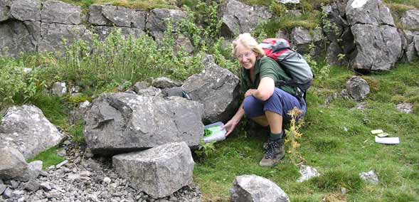 Dales Volunteer, Frances Bland, hiding one of the National Park Authority's geocaches